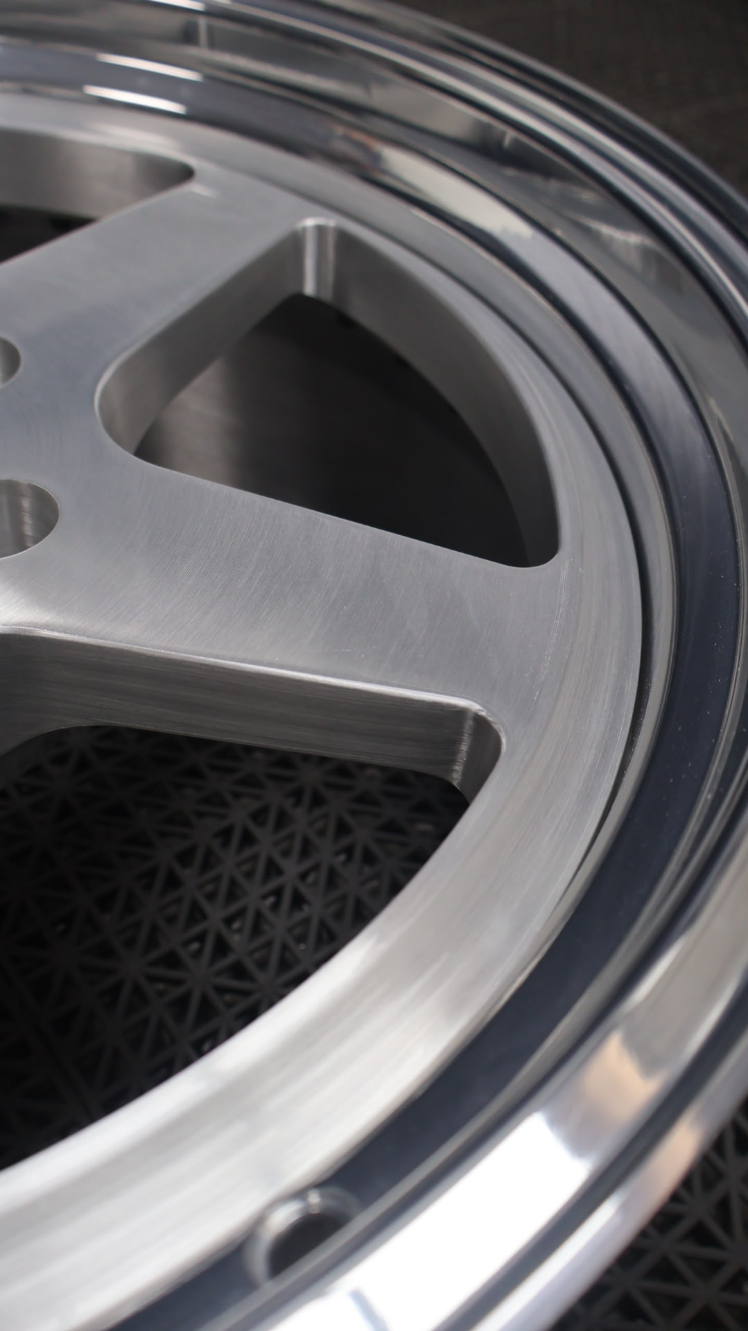 Close-up of a brushed forged Mone wheel face and polished lip